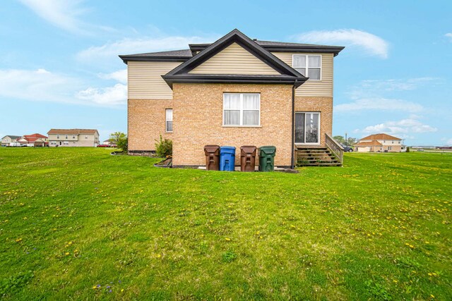 22334 Ojai Dr, Richton Park, IL 60471 - back of house with a yard and brick siding