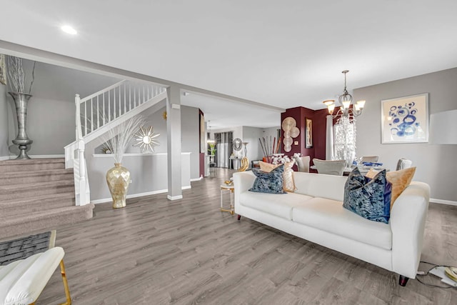 22334 Ojai Dr, Richton Park, IL 60471 - living room with stairs, a chandelier, wood finished floors, and baseboards