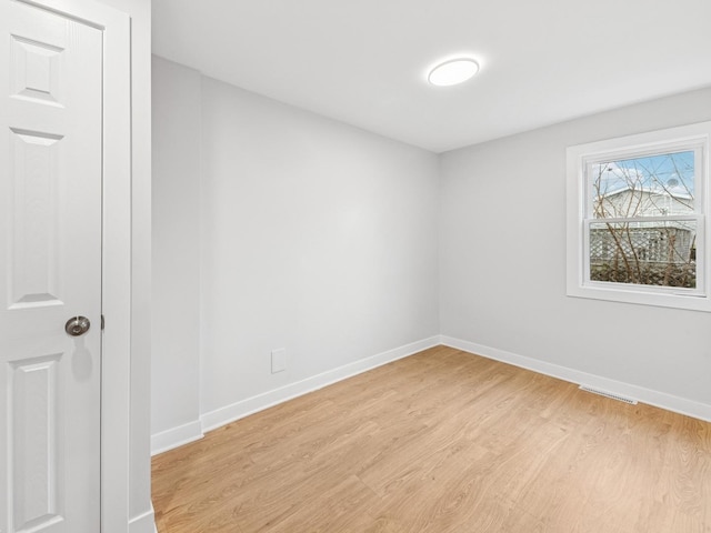 520 W Pheasant Ct, Round Lake Beach, IL 60073 - empty room with light wood-style floors and baseboards