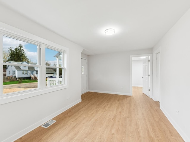 520 W Pheasant Ct, Round Lake Beach, IL 60073 - spare room featuring light wood-style floors and baseboards