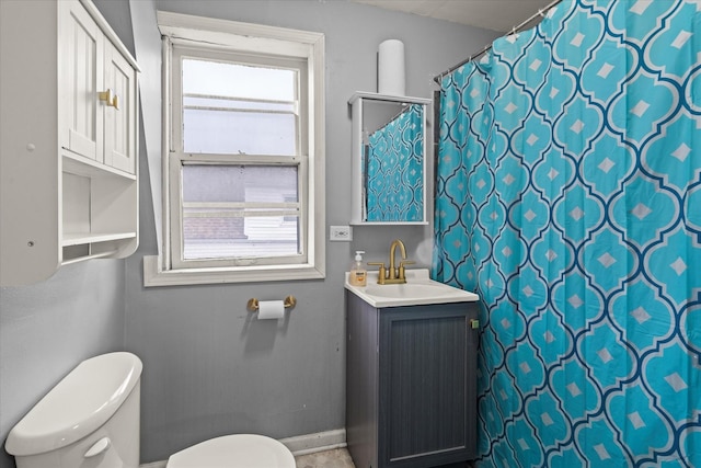 3823 W Wabansia Ave, Chicago, IL 60647 - bathroom featuring toilet, baseboards, vanity, and a shower with shower curtain