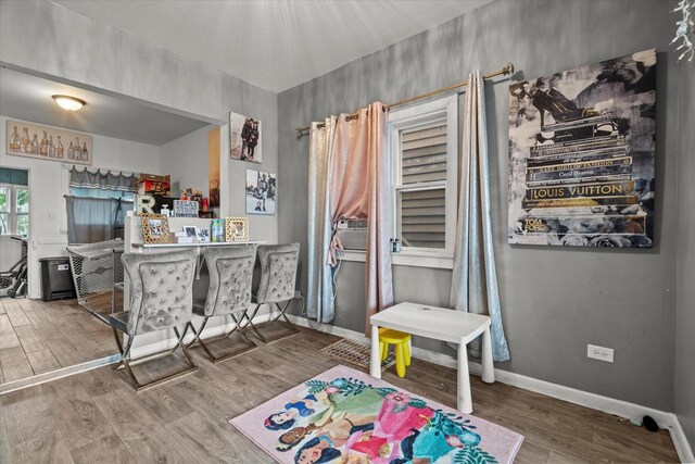 3823 W Wabansia Ave, Chicago, IL 60647 - rec room with wood finished floors, baseboards, and cooling unit