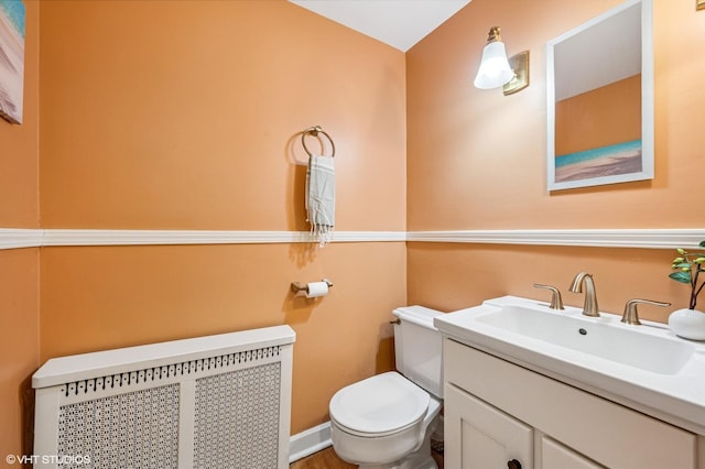 1117 Keystone Ave, River Forest, IL 60305 - half bathroom with radiator, vanity, and toilet