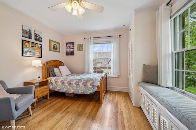 1117 Keystone Ave, River Forest, IL 60305 - bedroom featuring light wood-style flooring, baseboards, crown molding, and ceiling fan