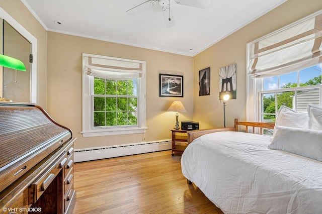 1117 Keystone Ave, River Forest, IL 60305 - bedroom featuring a baseboard heating unit, ornamental molding, wood-type flooring, and a ceiling fan