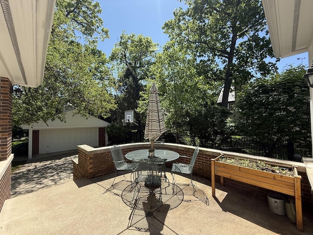 1117 Keystone Ave, River Forest, IL 60305 - view of patio featuring outdoor dining space, a vegetable garden, and a detached garage