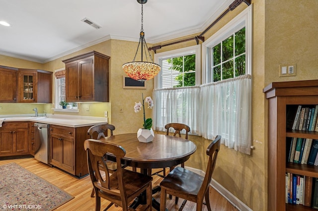 1117 Keystone Ave, River Forest, IL 60305 - dining space featuring light wood-style flooring, ornamental molding, and baseboards