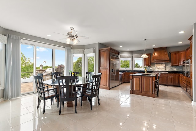21186 Sage Brush Ln, Mokena, IL 60448 - dining room featuring a ceiling fan, light tile patterned flooring, and recessed lighting