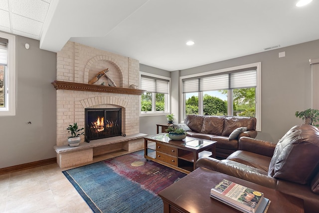 21186 Sage Brush Ln, Mokena, IL 60448 - living area with a brick fireplace, baseboards, recessed lighting, and tile patterned flooring