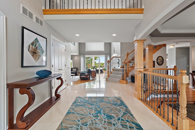 21186 Sage Brush Ln, Mokena, IL 60448 - foyer with light tile patterned flooring, recessed lighting, stairway, ornamental molding, and decorative columns
