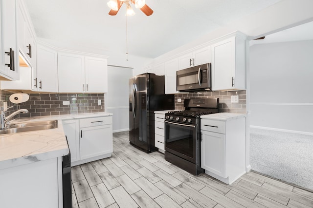 828 Huron Ct, Carol Stream, IL 60188 - kitchen featuring stainless steel appliances, a sink, a ceiling fan, backsplash, and white cabinetry