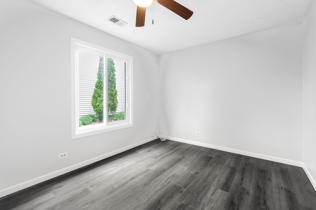 828 Huron Ct, Carol Stream, IL 60188 - spare room featuring dark wood finished floors, a ceiling fan, and baseboards