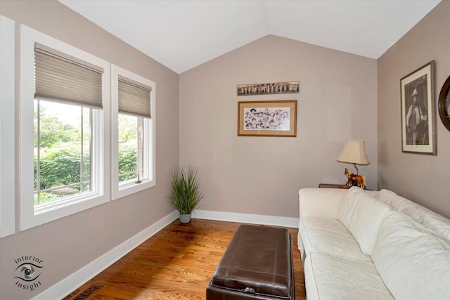 1233 Prairie Ln, Lemont, IL 60439 - living area with lofted ceiling, baseboards, and wood finished floors