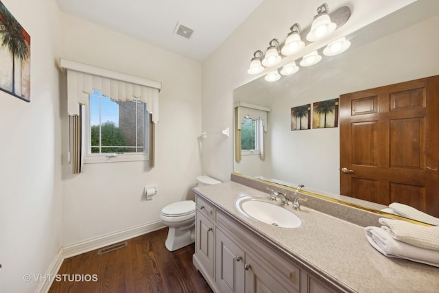 3620 Schillinger Ct, Naperville, IL 60564 - bathroom featuring baseboards, toilet, wood finished floors, and vanity