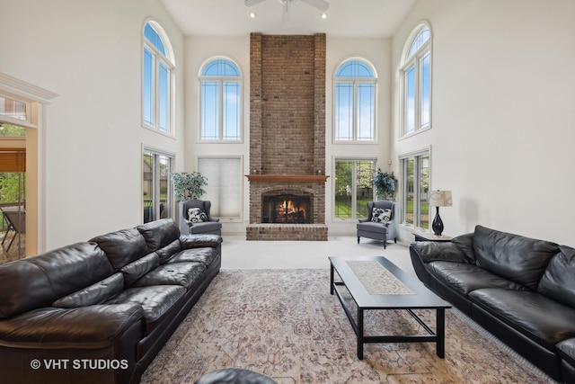 3620 Schillinger Ct, Naperville, IL 60564 - carpeted living room with a towering ceiling, plenty of natural light, a ceiling fan, and a fireplace