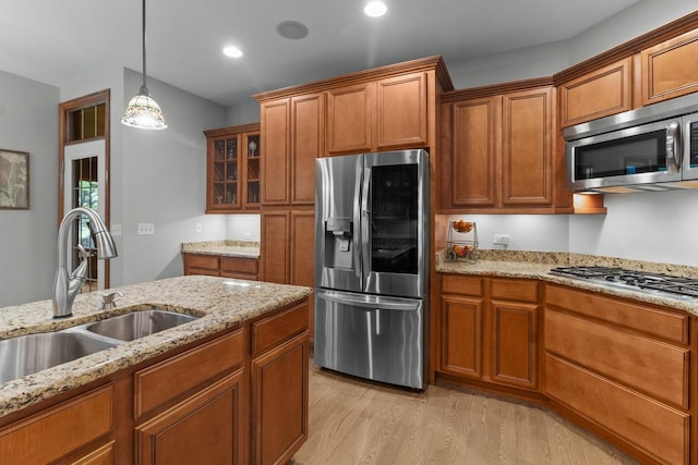 10920 Preservation Way, Richmond, IL 60071 - kitchen with stainless steel appliances, a sink, brown cabinetry, light wood-style flooring, and recessed lighting