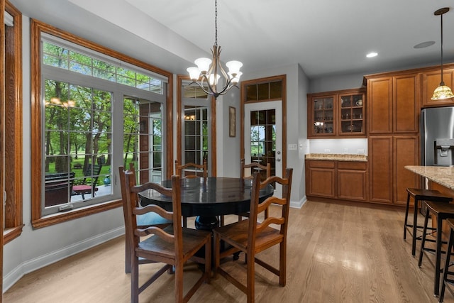10920 Preservation Way, Richmond, IL 60071 - dining space featuring healthy amount of natural light, light wood-style floors, and baseboards