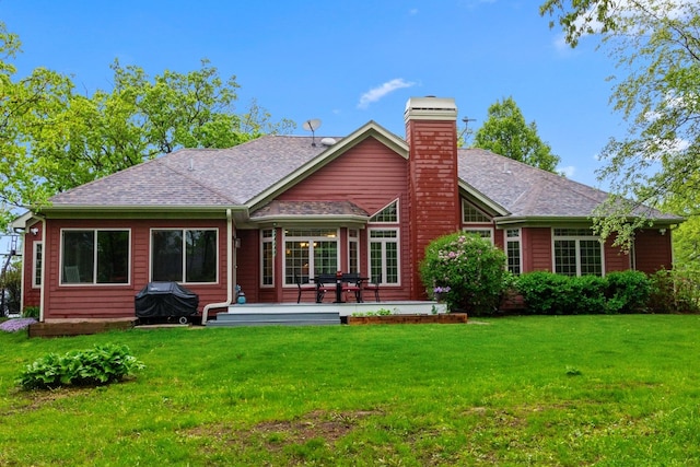 10920 Preservation Way, Richmond, IL 60071 - rear view of house with a chimney, a yard, and roof with shingles