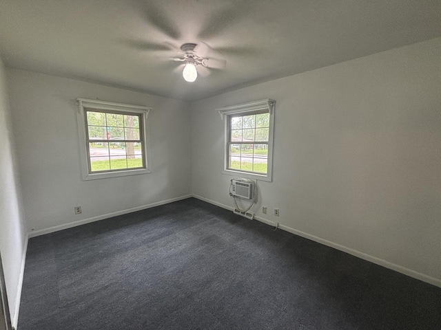 85 Circle Dr E, Montgomery, IL 60538 - spare room featuring healthy amount of natural light, baseboards, dark colored carpet, and a ceiling fan
