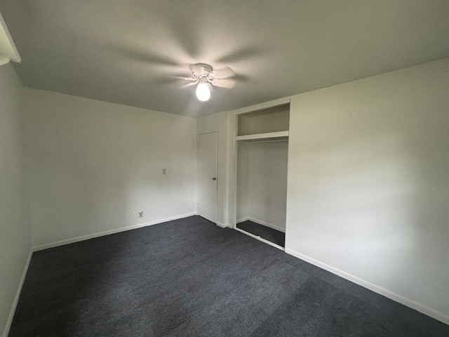 85 Circle Dr E, Montgomery, IL 60538 - unfurnished bedroom featuring baseboards, dark carpet, a closet, and a ceiling fan