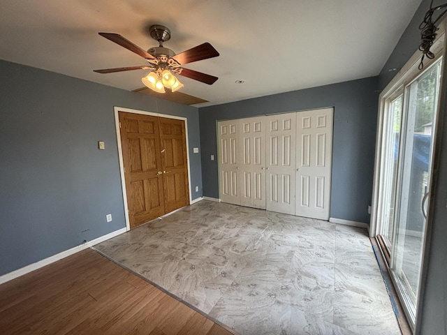 85 Circle Dr E, Montgomery, IL 60538 - unfurnished bedroom featuring baseboards, ceiling fan, a closet, wood finished floors, and access to exterior