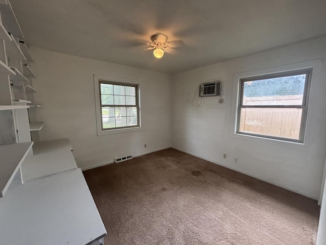 85 Circle Dr E, Montgomery, IL 60538 - unfurnished living room with a ceiling fan, an AC wall unit, carpet flooring, and baseboards