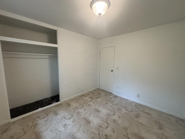 85 Circle Dr E, Montgomery, IL 60538 - unfurnished bedroom featuring a closet and baseboards