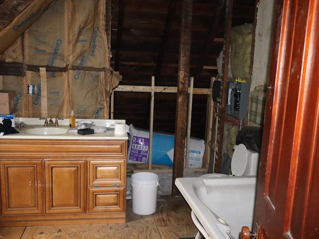312 S Monroe St, Streator, IL 61364 - bathroom featuring electric panel, vanity, and toilet