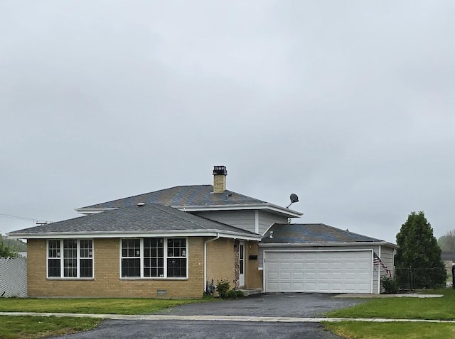 177 E Fullerton Ave, Glendale Heights, IL 60139 - view of front of property featuring brick siding, a chimney, asphalt driveway, a garage, and a shingled roof