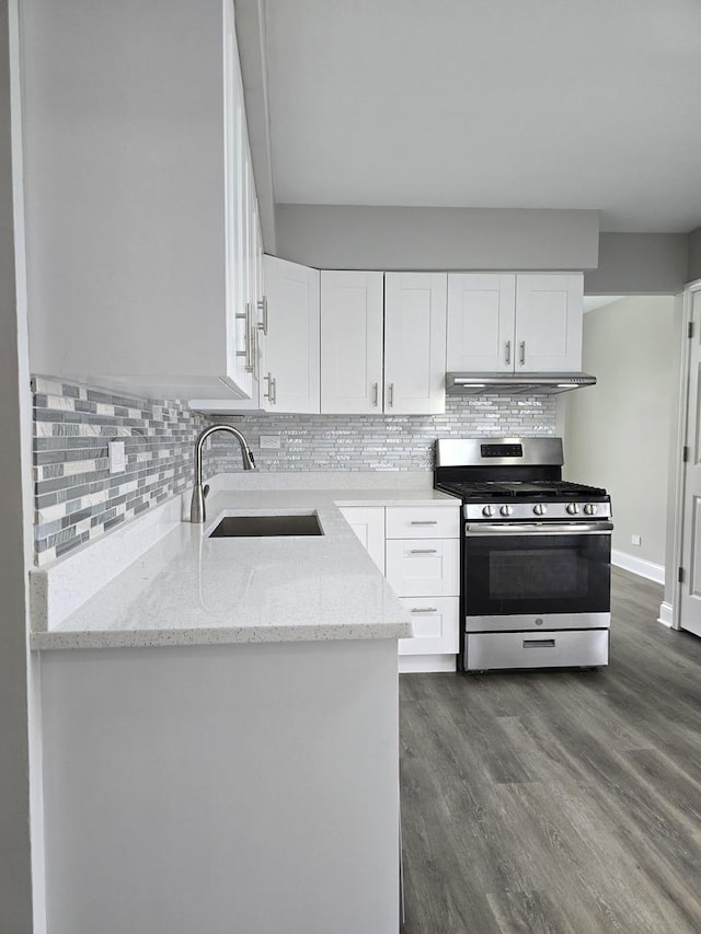 177 E Fullerton Ave, Glendale Heights, IL 60139 - kitchen with stainless steel gas range oven, a sink, light stone countertops, under cabinet range hood, and white cabinets