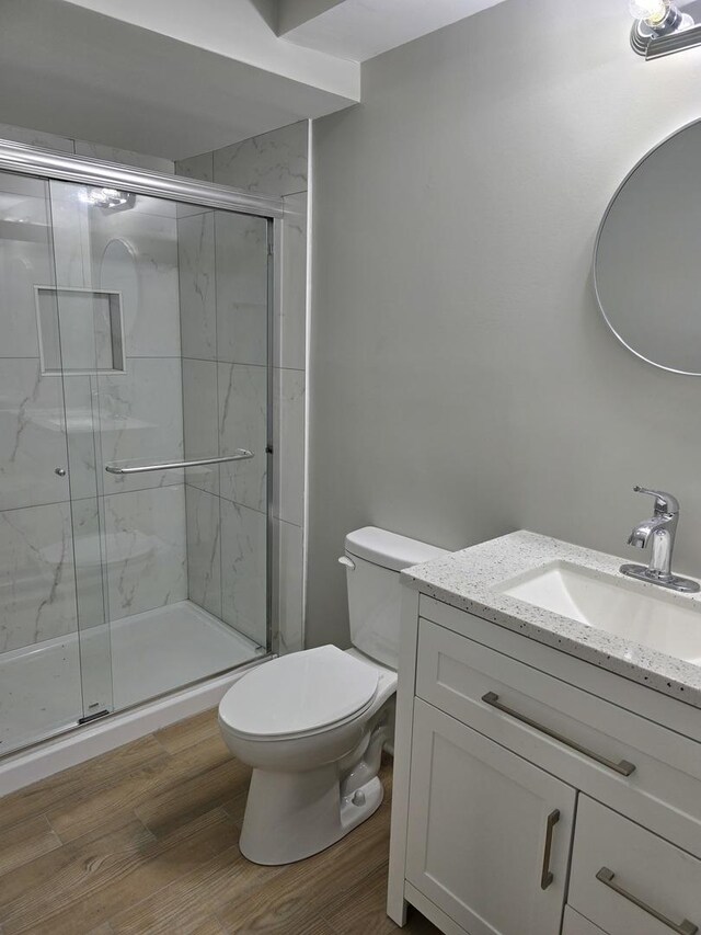 177 E Fullerton Ave, Glendale Heights, IL 60139 - full bath featuring toilet, vanity, a shower stall, and wood finished floors