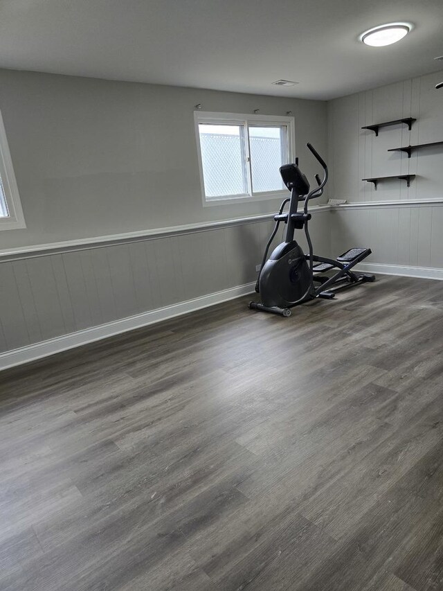 177 E Fullerton Ave, Glendale Heights, IL 60139 - exercise room featuring wood finished floors, baseboards, a wainscoted wall, and a decorative wall