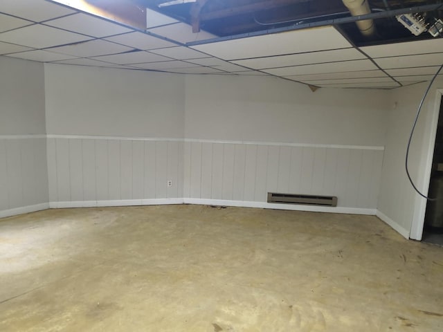 39460 N Park Ave, Lake Villa, IL 60046 - basement featuring a baseboard heating unit, wainscoting, a drop ceiling, and baseboards