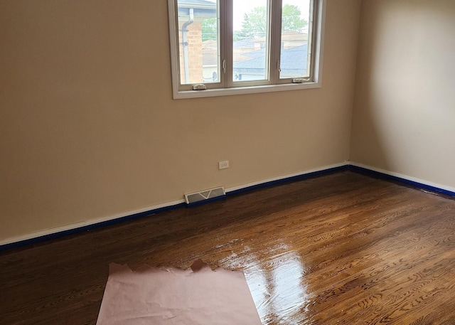 526 Marquette Ave, Calumet City, IL 60409 - spare room with dark wood-style floors and baseboards