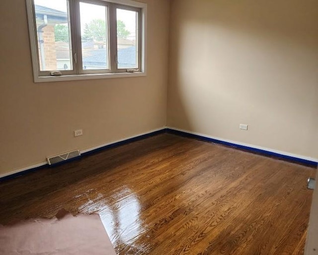 526 Marquette Ave, Calumet City, IL 60409 - unfurnished room with baseboards and dark wood finished floors