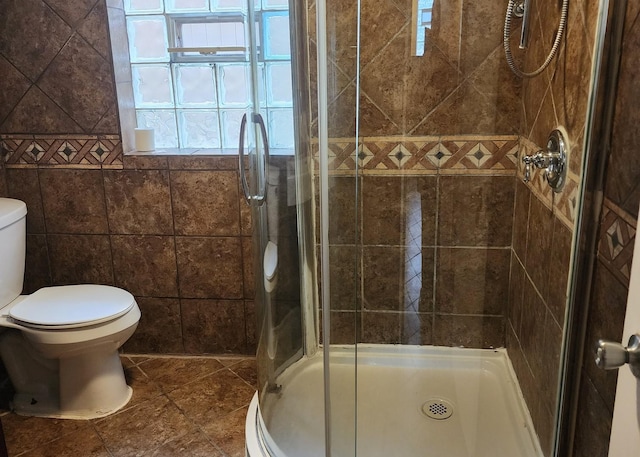 526 Marquette Ave, Calumet City, IL 60409 - bathroom featuring toilet, a stall shower, and tile patterned floors