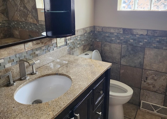 526 Marquette Ave, Calumet City, IL 60409 - half bath featuring tile walls, vanity, toilet, and tile patterned floors