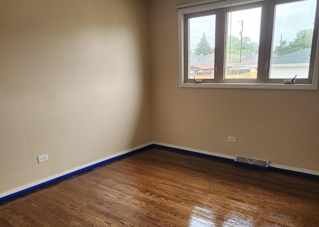 526 Marquette Ave, Calumet City, IL 60409 - empty room with dark wood-style floors and baseboards