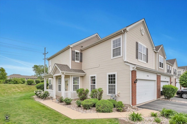 15255 Kenmare Cir, Manhattan, IL 60442 - view of property exterior featuring a garage, a yard, and driveway
