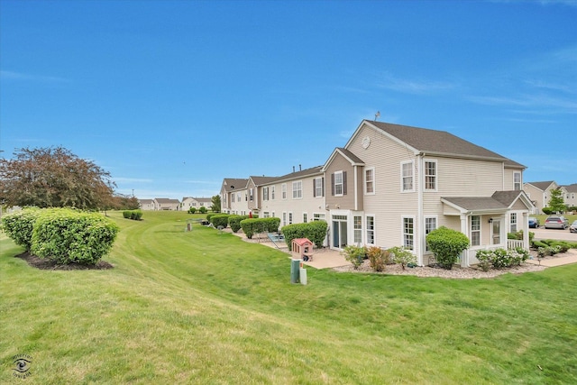 15255 Kenmare Cir, Manhattan, IL 60442 - rear view of house with a lawn and a residential view