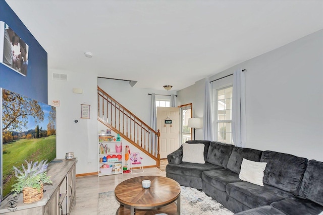 15255 Kenmare Cir, Manhattan, IL 60442 - living area with stairway and light wood-style flooring