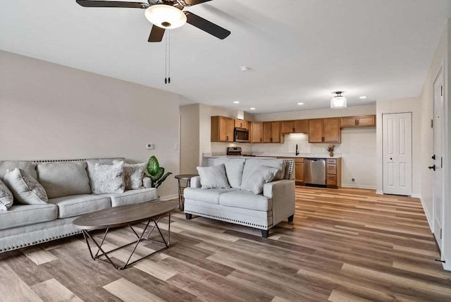 2034 W 75th Pl Unit 36, Merrillville, IN 46410 - living room featuring light wood-style flooring, a ceiling fan, recessed lighting, and baseboards
