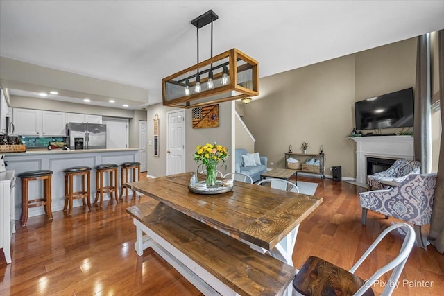 3208 Raphael Ct, Saint Charles, IL 60175 - dining room featuring wood finished floors, a fireplace, and recessed lighting