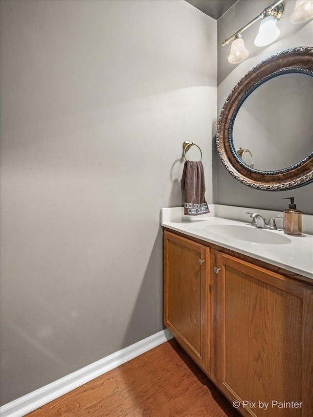 3208 Raphael Ct, Saint Charles, IL 60175 - bathroom featuring wood finished floors, vanity, and baseboards