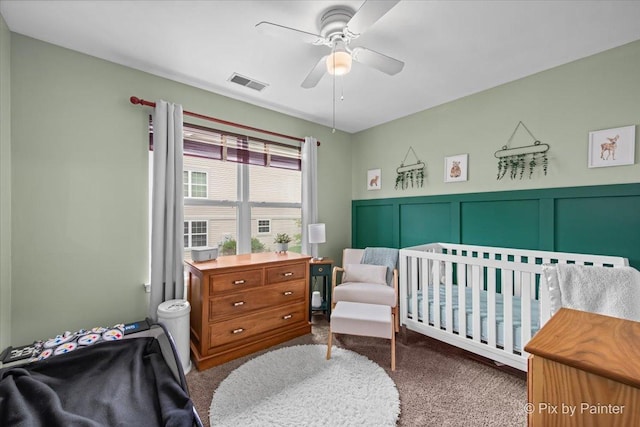 3208 Raphael Ct, Saint Charles, IL 60175 - bedroom featuring carpet, a ceiling fan, a nursery area, a wainscoted wall, and a decorative wall