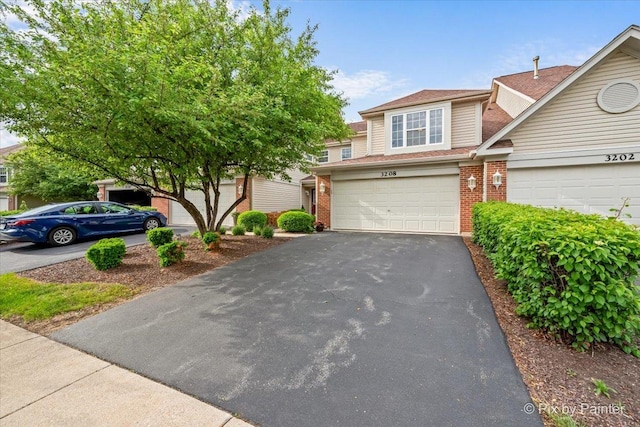 3208 Raphael Ct, Saint Charles, IL 60175 - view of front of property featuring brick siding, driveway, and a garage