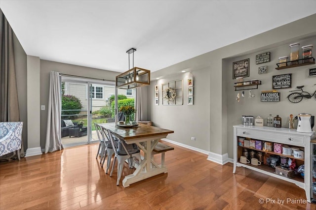 3208 Raphael Ct, Saint Charles, IL 60175 - dining room with baseboards, wood finished floors, and a chandelier