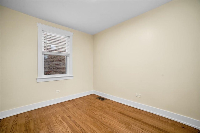 6014 W Fletcher St, Chicago, IL 60634 - unfurnished room featuring baseboards and light wood-style floors