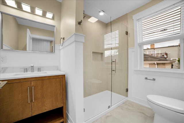 6014 W Fletcher St, Chicago, IL 60634 - bathroom with a shower stall, vanity, toilet, marble look tiles, and baseboards