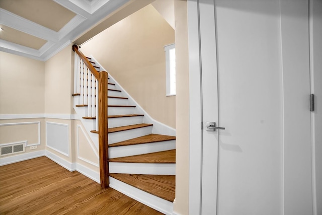 6014 W Fletcher St, Chicago, IL 60634 - stairway featuring wood finished floors, wainscoting, beam ceiling, crown molding, and coffered ceiling